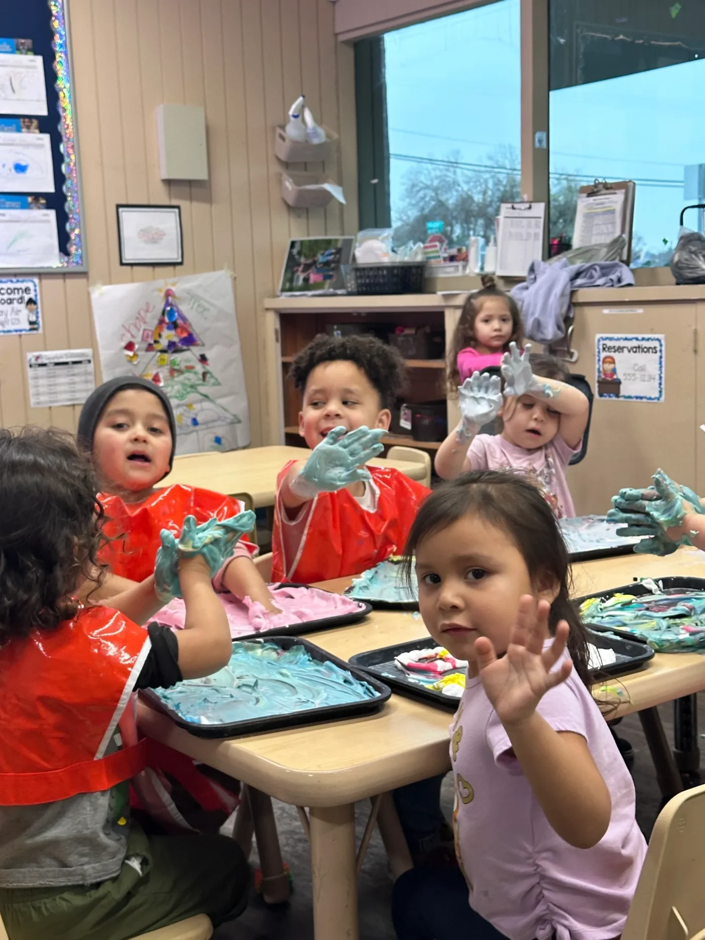 kids are playing with paint